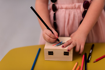 Image showing little girl painting jewelry box