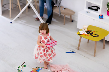 Image showing mother and little daughter spending time together at home