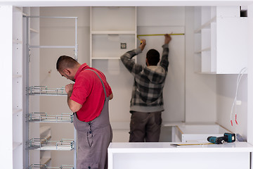 Image showing workers installing a new kitchen