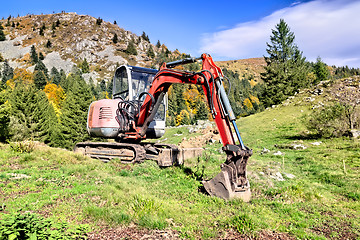 Image showing A digger in the mountains