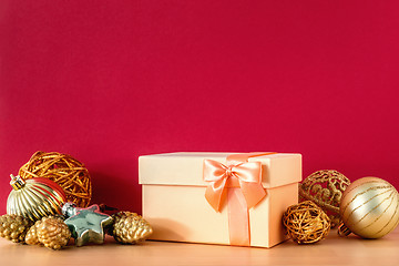 Image showing Christmas gift box on red background