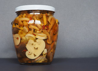 Image showing mixed champignons and porcini mushrooms in jar