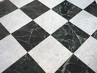 Image showing chequered white green and black stone floor background