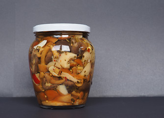 Image showing mixed champignons and porcini mushrooms in jar