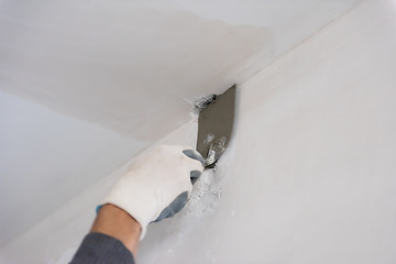 Image showing construction worker plastering on gypsum walls