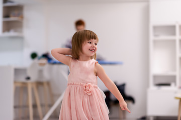 Image showing mother and little daughter spending time together at home