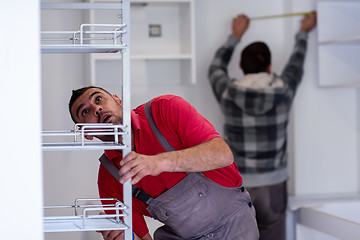 Image showing workers installing a new kitchen