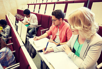 Image showing group of students with notebooks at lecture hall