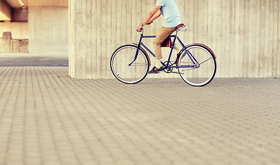 Image showing hipster man riding fixed gear bike