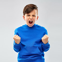 Image showing angry boy in blue hoodie celebrating success