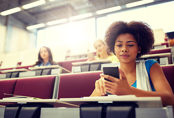 Image showing african student girl with smartphone at lecture