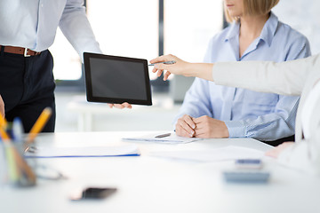 Image showing close up of business team with tablet pc at office