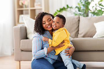 Image showing happy african american mother with baby at home