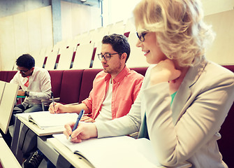 Image showing group of students with notebooks at lecture hall