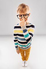 Image showing smiling boy in glasses and striped pullover