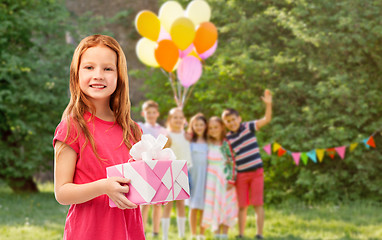 Image showing red haired girl with gift at birthday party