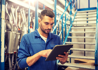 Image showing auto mechanic or smith with tablet pc at workshop