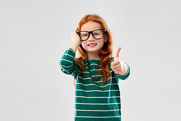 Image showing smiling red haired student girl in glasses