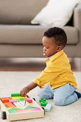 Image showing african american baby boy playing with toy blocks