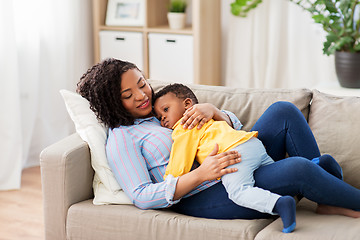 Image showing happy african american mother with baby at home