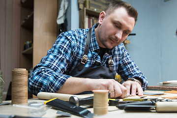 Image showing Concept of handmade craft production of leather goods.