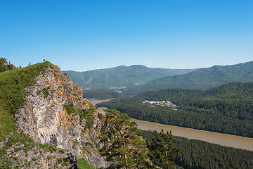 Image showing Man standing on top of cliff