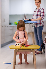 Image showing mother and daughter spending time together at home