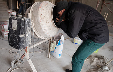 Image showing professional photographer on construction site