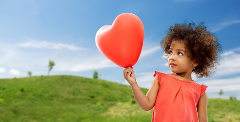 Image showing african american girl with heart shaped balloon