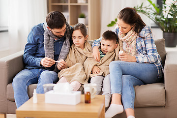 Image showing family with ill children having fever at home