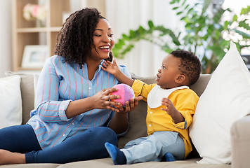 Image showing mother and baby playing with ball at home