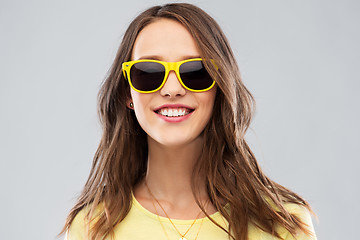 Image showing teenage girl in yellow sunglasses and t-shirt