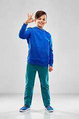 Image showing boy in blue hoodie showing ok hand sign