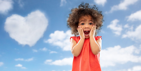 Image showing surprised little african american girl over sky