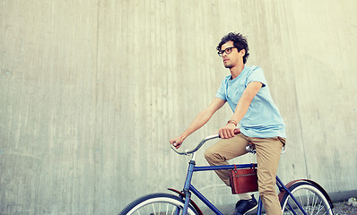 Image showing young hipster man riding fixed gear bike