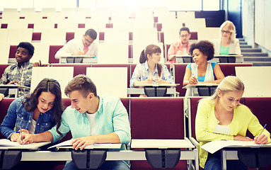 Image showing group of students with notebooks at lecture hall