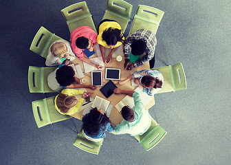 Image showing group of students with tablet pc at school library