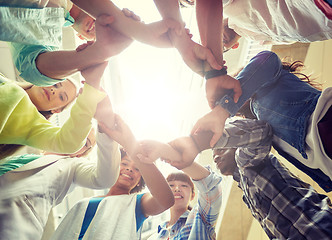 Image showing group of international students holding hands