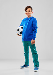 Image showing smiling boy in blue hoodie with soccer ball