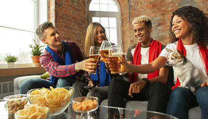 Image showing Excited group of people watching sport match, championship at home