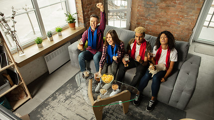 Image showing Excited group of people watching sport match, championship at home