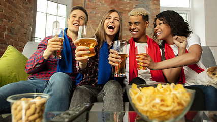 Image showing Excited group of people watching sport match, championship at home