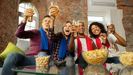 Image showing Excited group of people watching sport match, championship at home