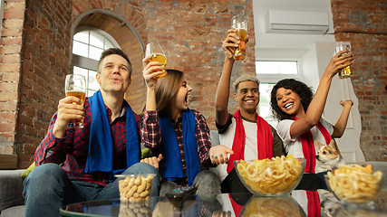 Image showing Excited group of people watching sport match, championship at home