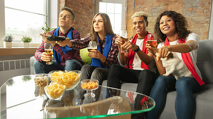 Image showing Excited group of people watching sport match, championship at home