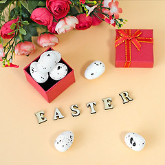 Image showing Festive Easter card with a bouquet of roses and a red box