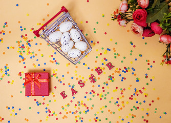 Image showing Festive Easter card with a bouquet of roses and a red box