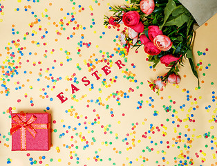 Image showing Festive Easter card with a bouquet of roses and a red box