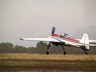 Image showing Aerobatic plane landing