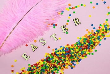 Image showing Abstract easter card with scattered color confectionery balls and letters. Easter holiday concept.